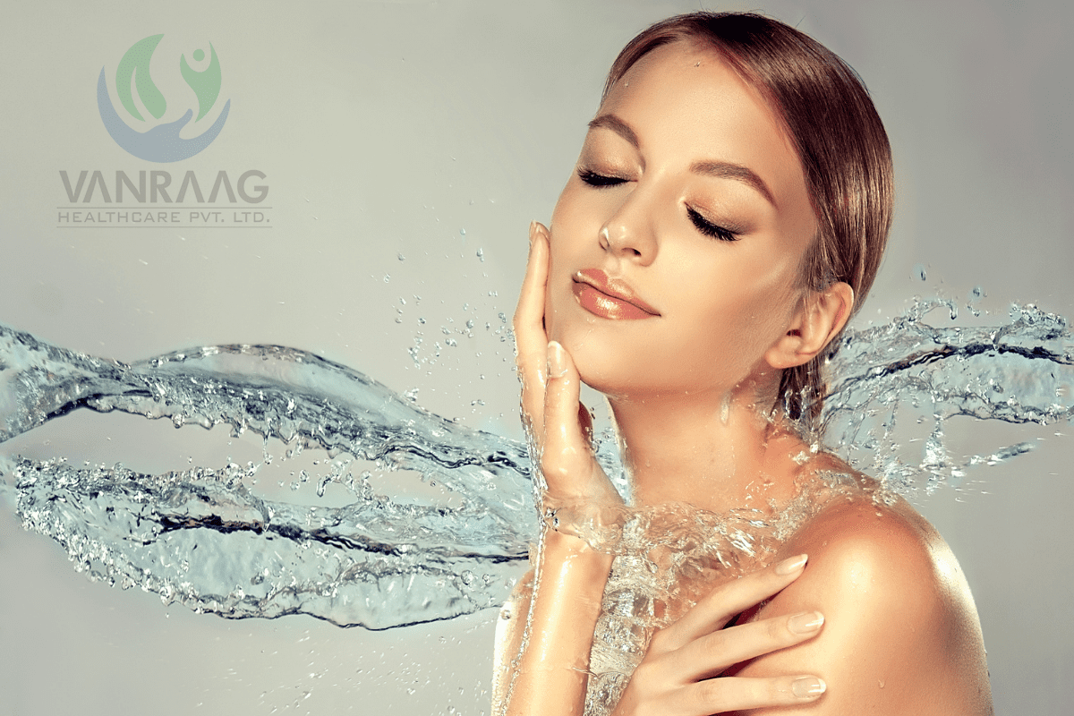 Woman with closed eyes, hydrating with Vanraag Day Cream amidst splashing water